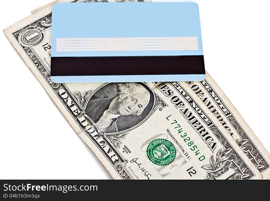 Bank credit card and dollars isolated on a white background