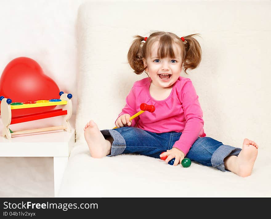 Little Girl Playing With Toys