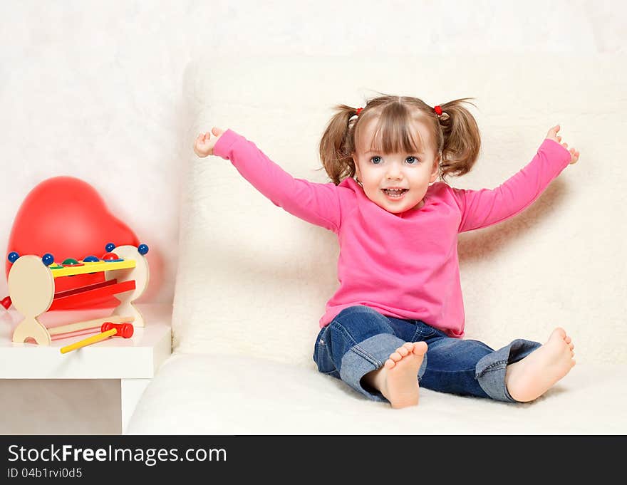 Little girl playing with toys