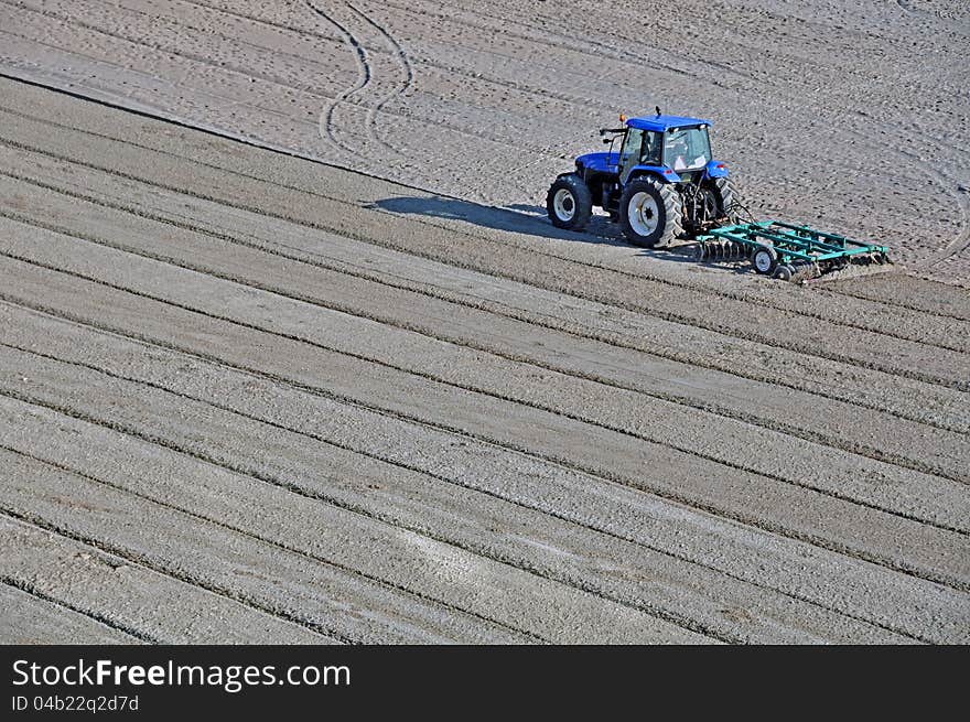 Tractor on the beach and Sunrise over the Black Sea at Mamaia resort near Constanta city in Romania. Tractor on the beach and Sunrise over the Black Sea at Mamaia resort near Constanta city in Romania