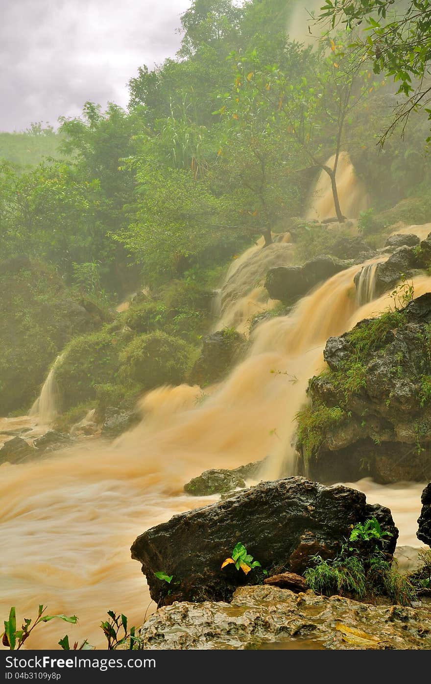 Muddy stream of a waterfall in Java, just after the rain. Muddy stream of a waterfall in Java, just after the rain