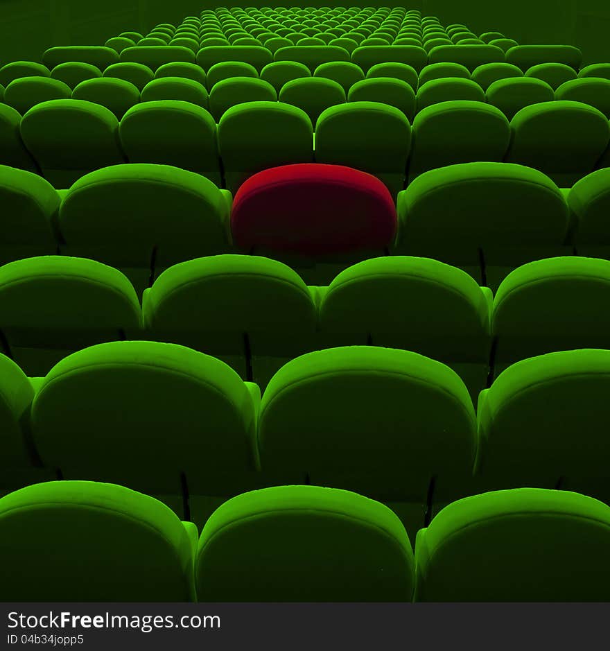 Green cinema or theater empty seats with red one. Green cinema or theater empty seats with red one