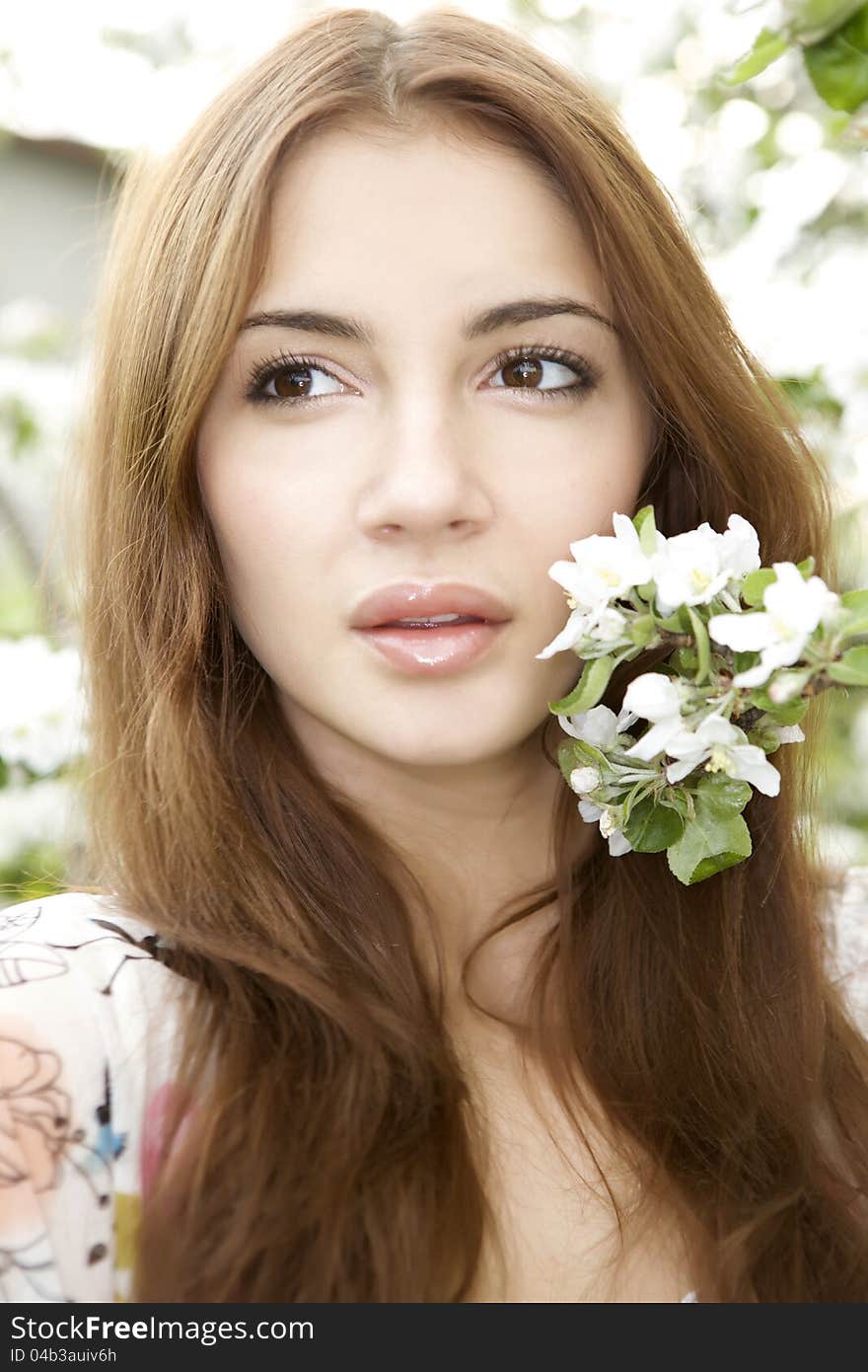 Beautiful brunette in the garden