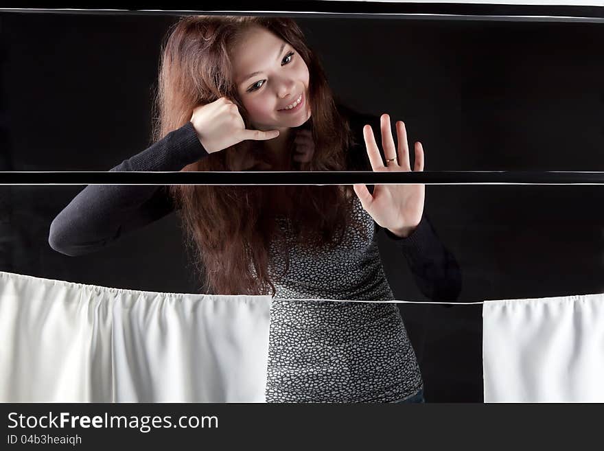 Young girl in the train window is goodbay