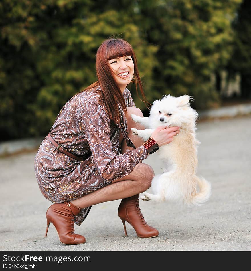 Cute puppie and happy young girl