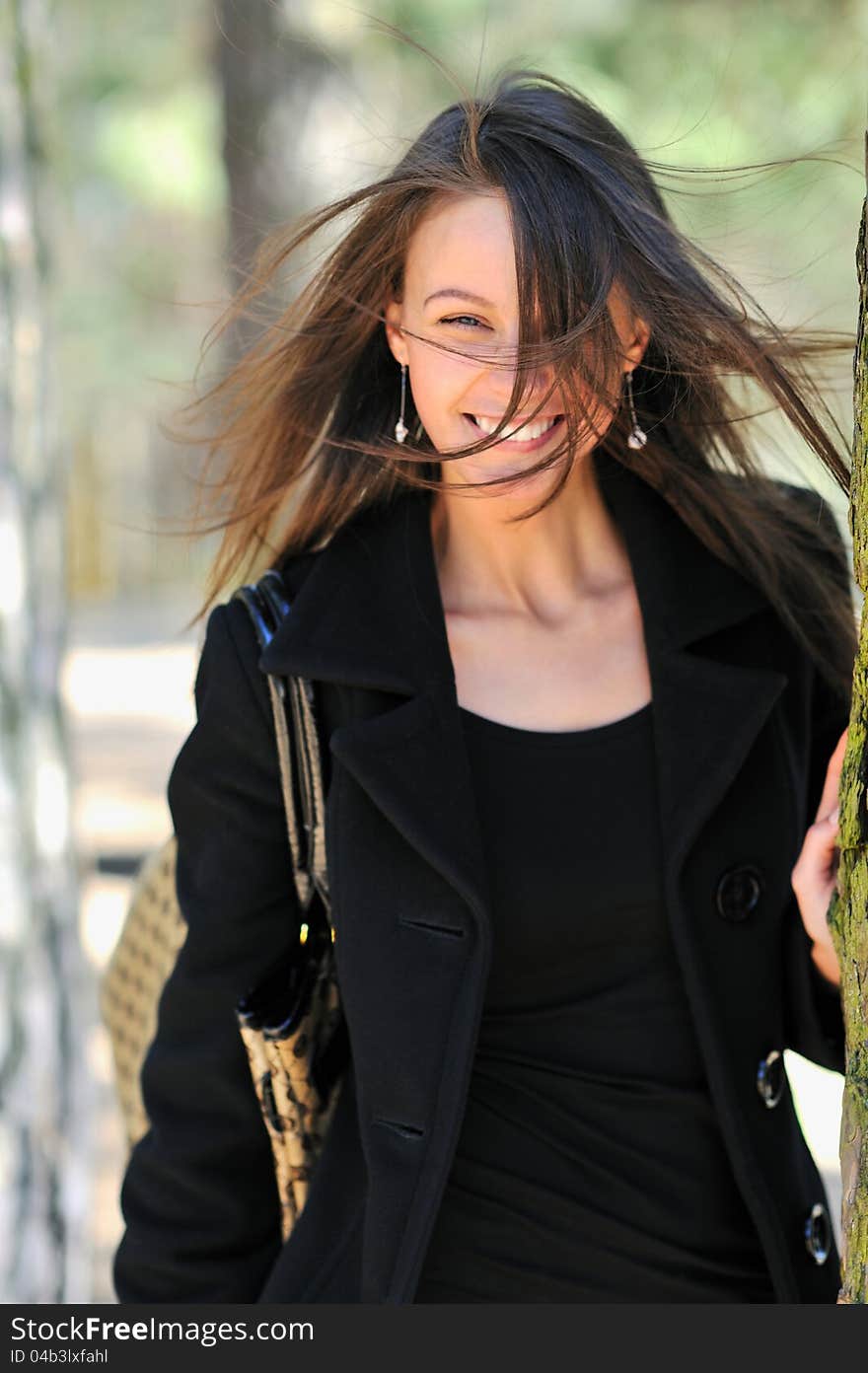 Portrait of a beautiful young lady smiling. Focus on hair