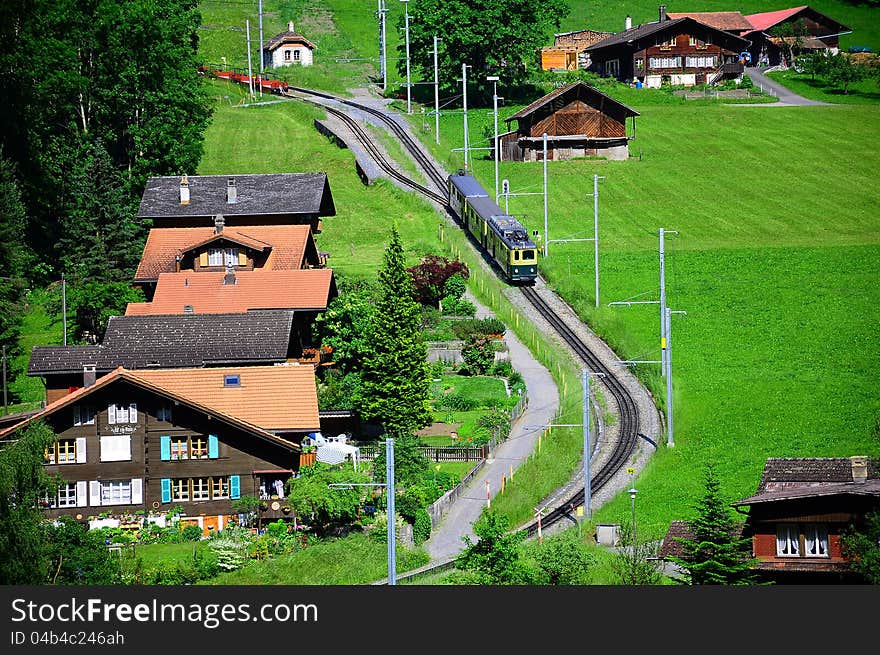 Railway station in swiss Alps. Arrival of the train. Switzerland. Railway station in swiss Alps. Arrival of the train. Switzerland.