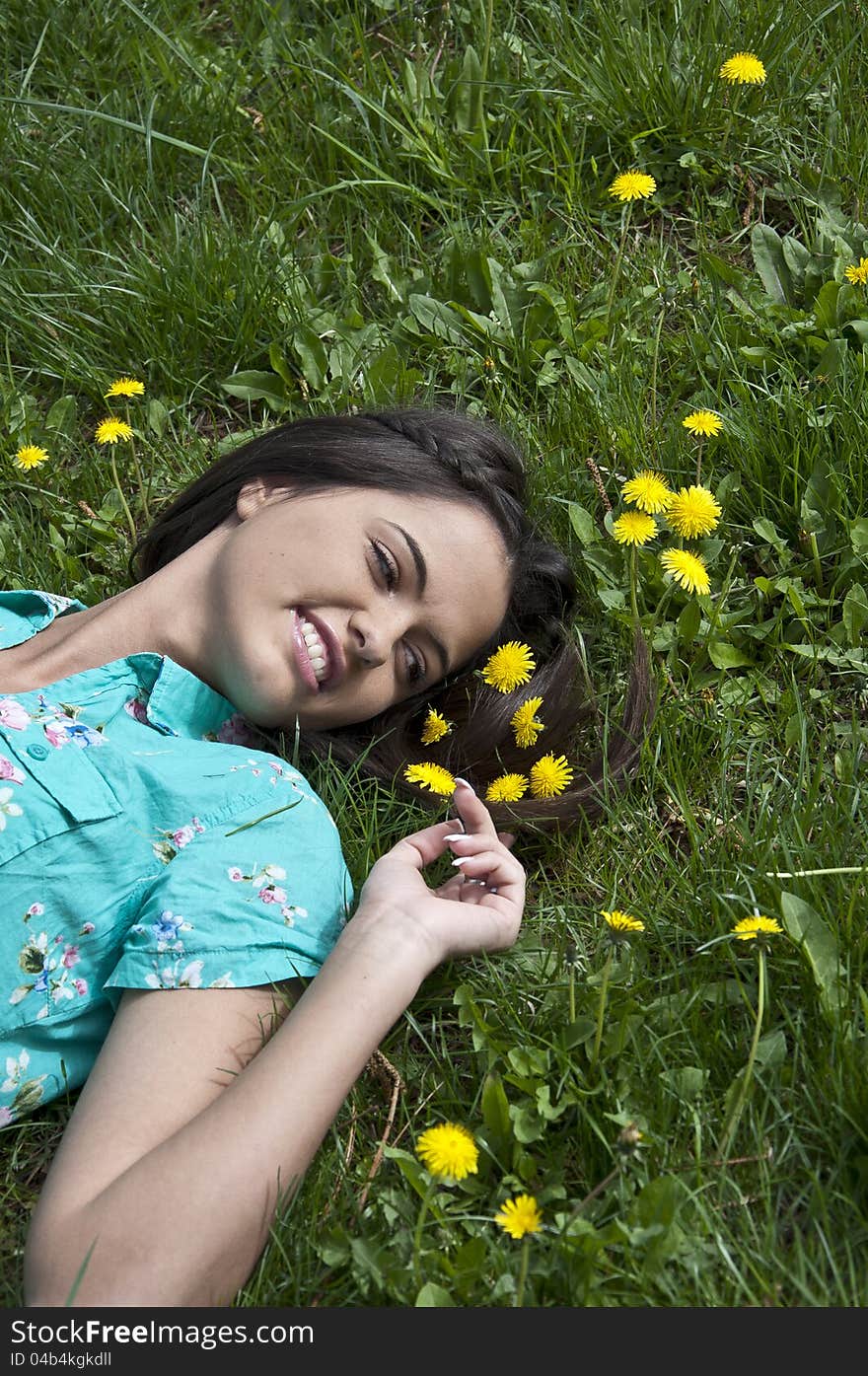 Young Beautiful Woman In The Park