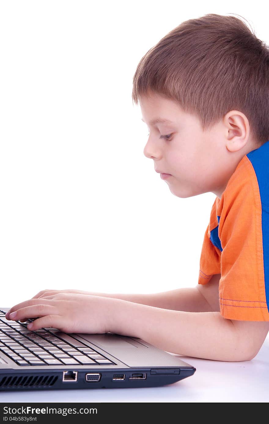 A Child Plays With A Notebook