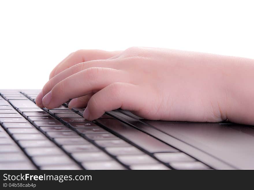 Child's hands on the keyboard of notebook. Child's hands on the keyboard of notebook