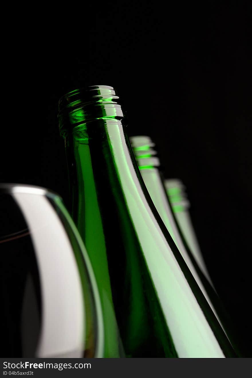 Bottles With Glass On Black Background