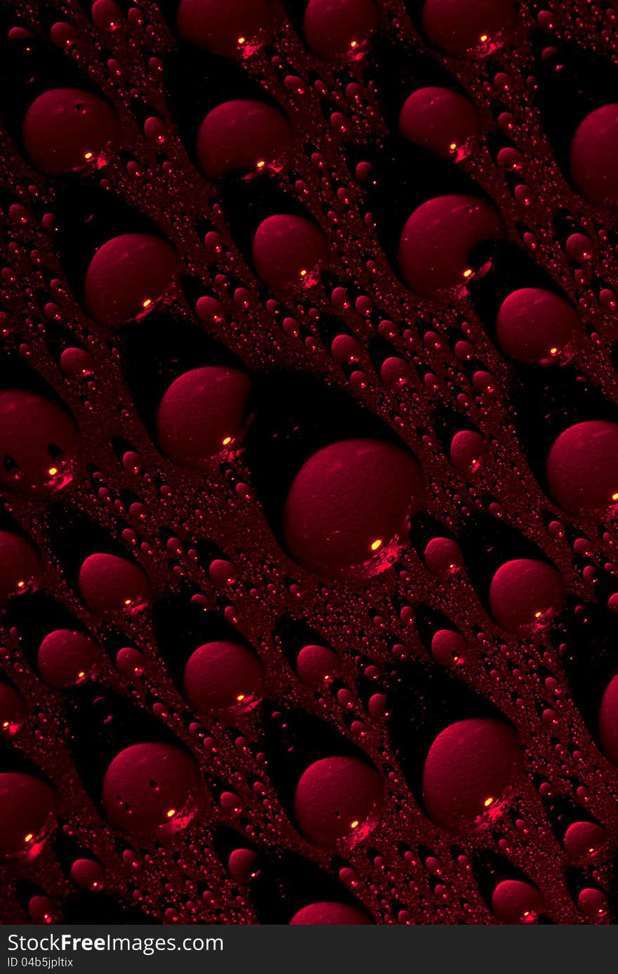 Crystal clear water drops over red background