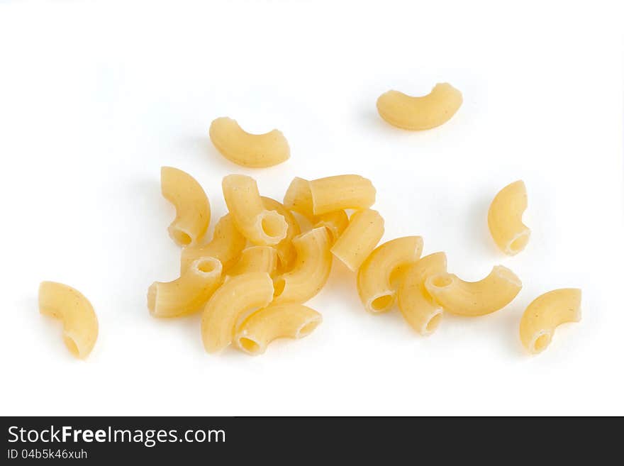 Closeup of a yellow macaroni on a white background