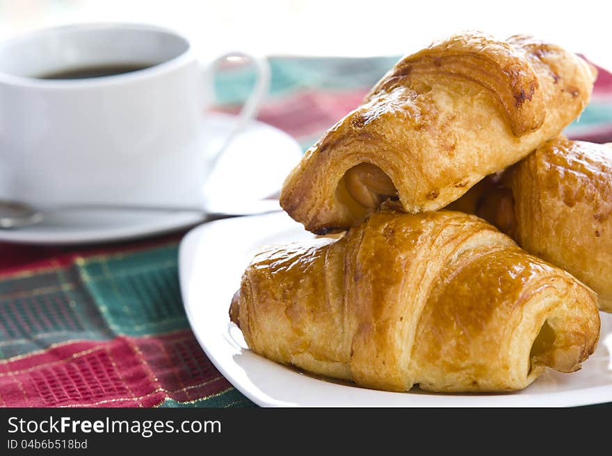 Breakfast With Black Coffee And Croissants