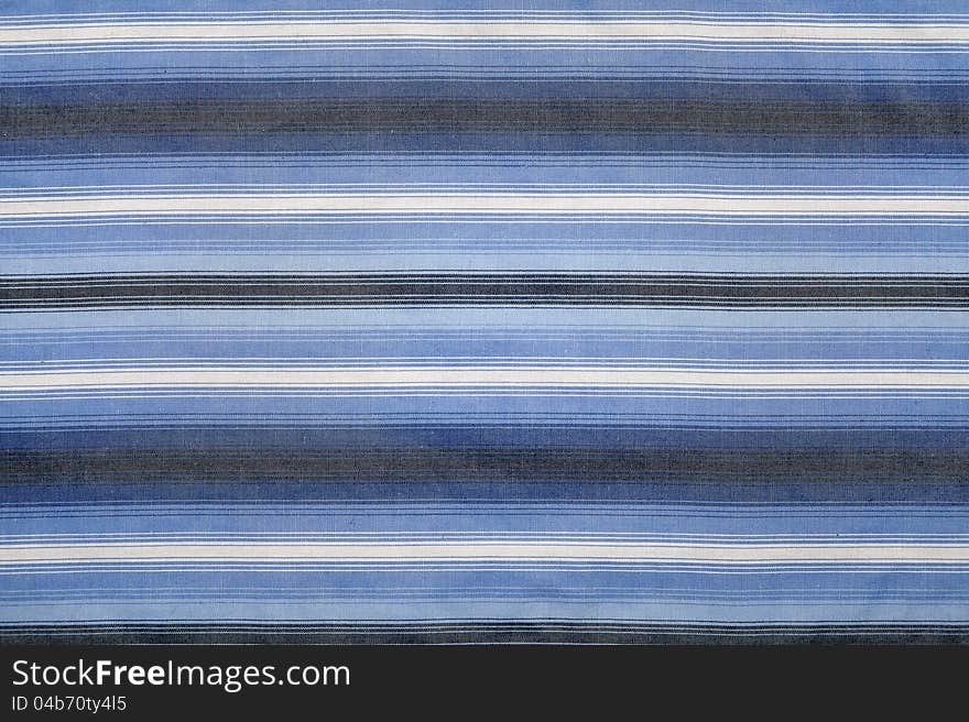 Close-up of a piece of blue and white striped fabric. Close-up of a piece of blue and white striped fabric