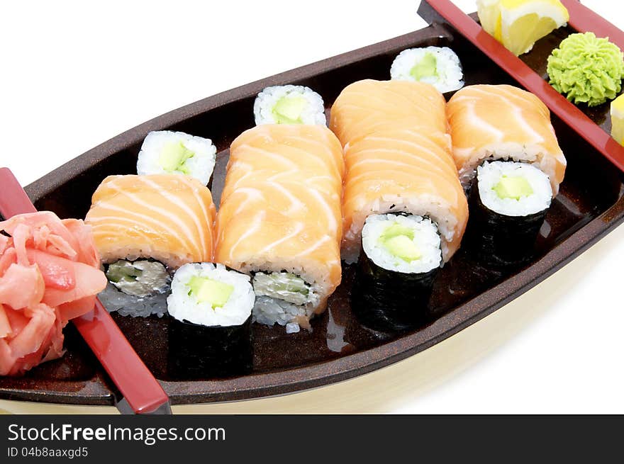 Portion of Japanese sushi with fish and rice on a white background