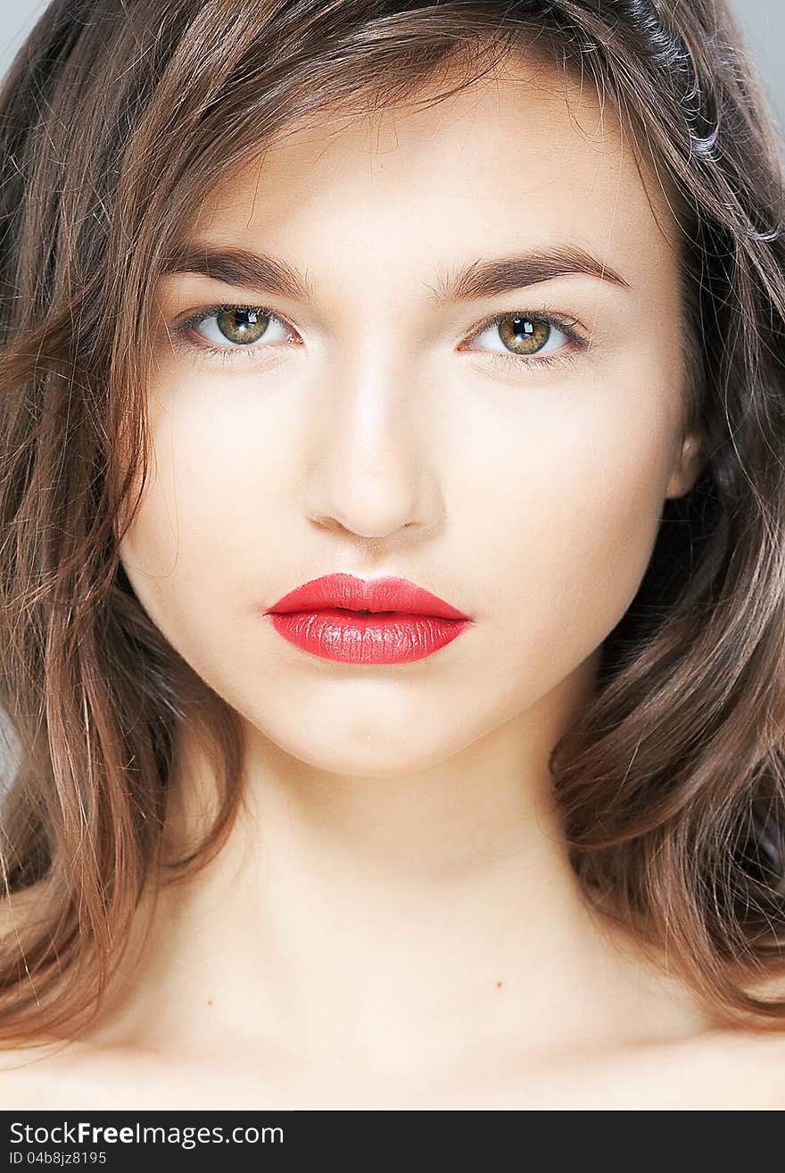 Portrait of beautiful female with sensual red lips closeup. Studio shot. Portrait of beautiful female with sensual red lips closeup. Studio shot