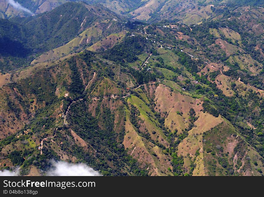 Ribbons of road winding across Costa Rican mountaintops, from the air. Ribbons of road winding across Costa Rican mountaintops, from the air