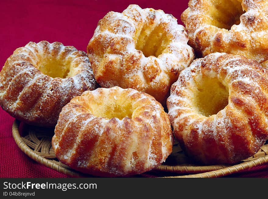 Sweet cupcakes in a wicker plate. Sweet cupcakes in a wicker plate