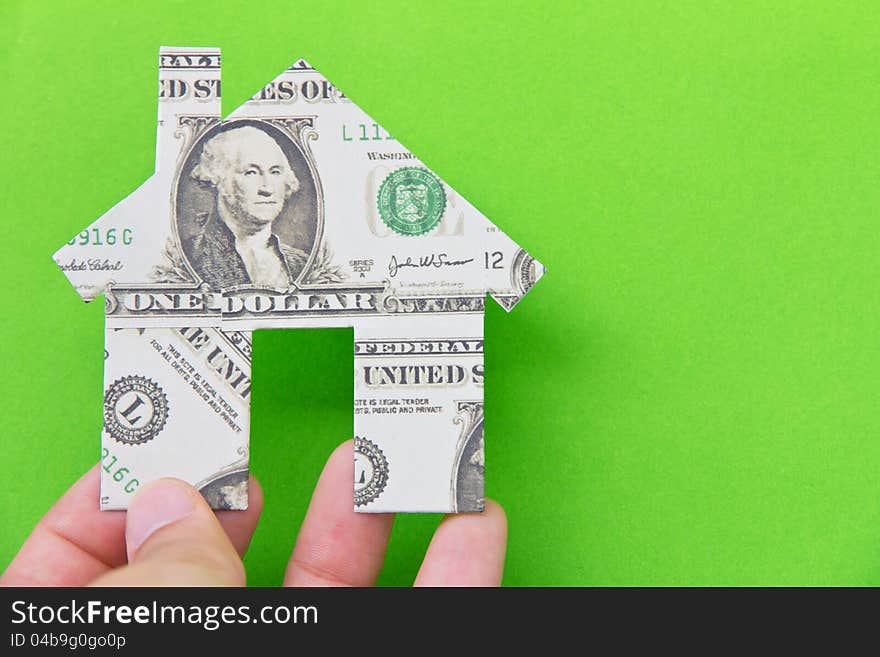 Banknote house icon isolate on green background