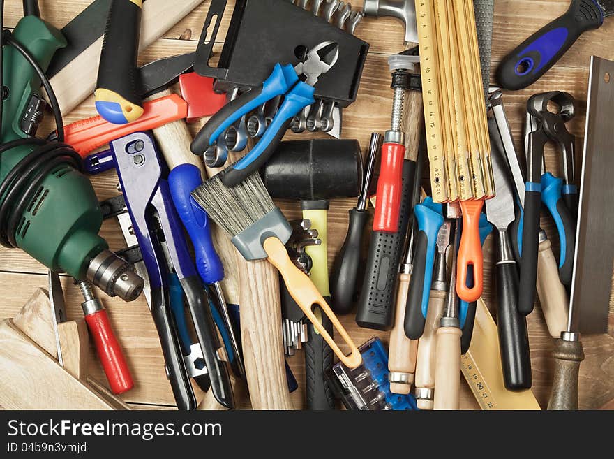 Set of different tools on a wooden planks