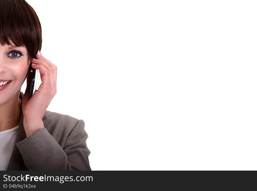 Image of a business lady making a phone call on her mobile phone. Image of a business lady making a phone call on her mobile phone