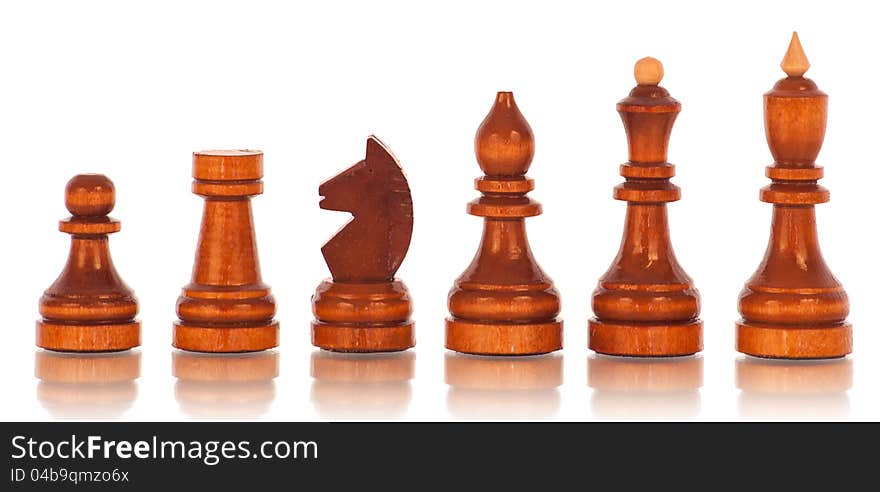 Chess. a group of black wooden chess pieces on a white background