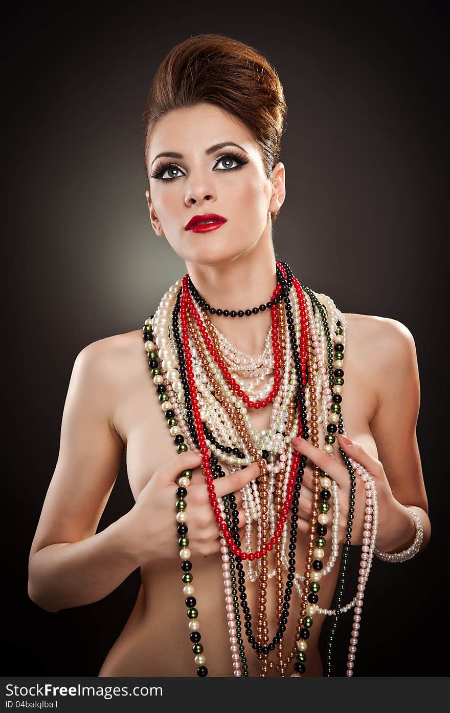 Portrait of beautiful woman with many beads