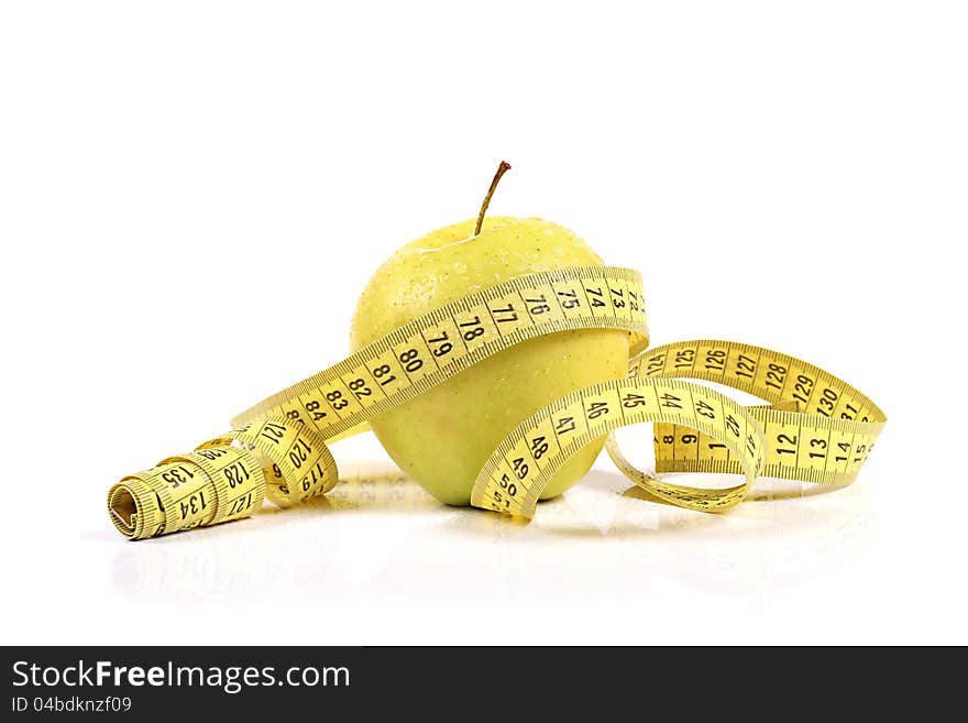 Green apple with measure tape. isolated on white background