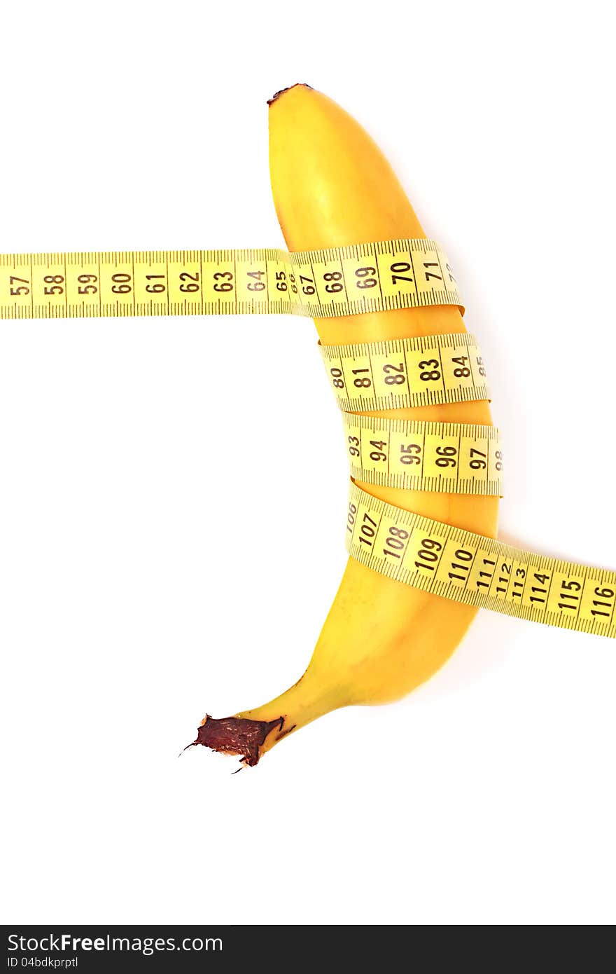 Diet concept. banana with measuring tape