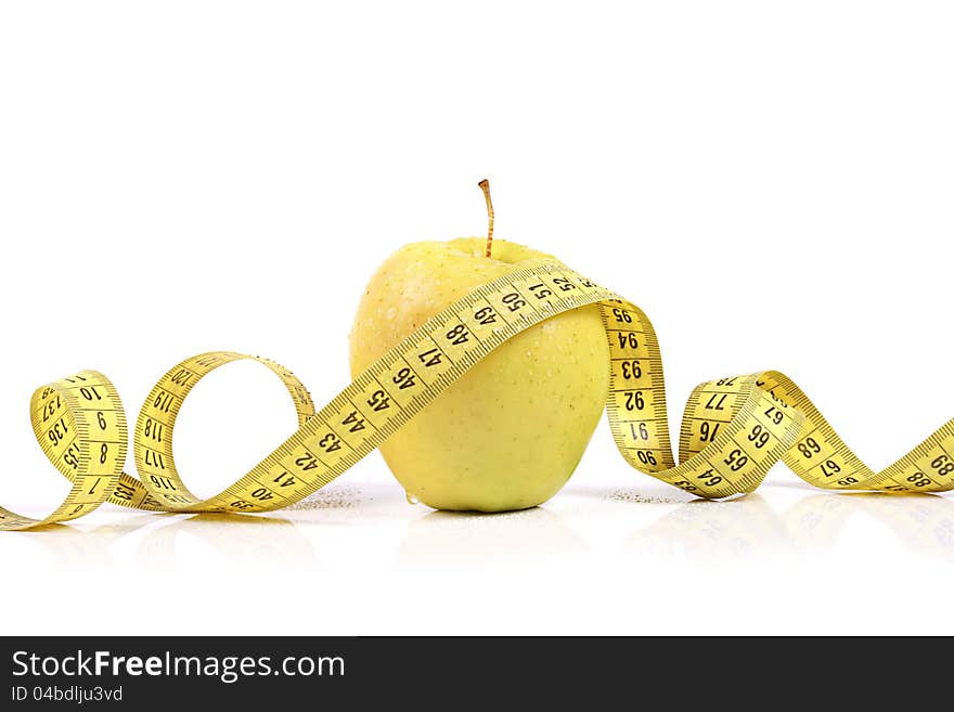 Fresh apple with measuring tape. isolated on white background