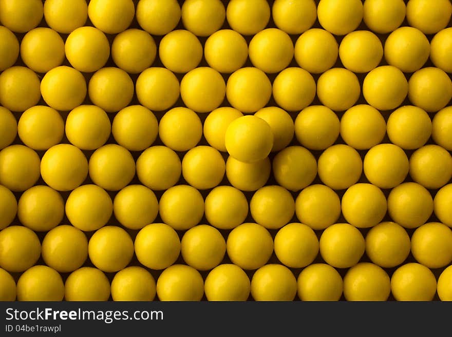 Yellow round pills background