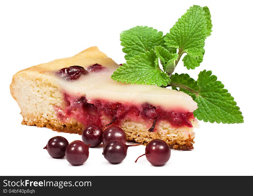 A piece of berry pie with mint leaves