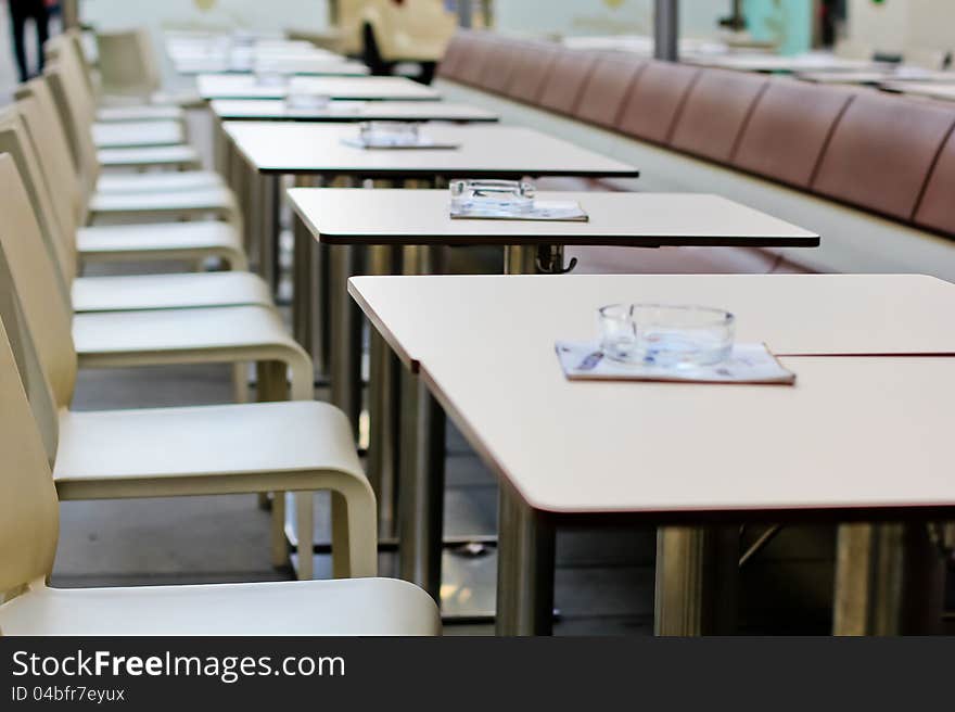 Row of cafe tables, outdoor cafe,