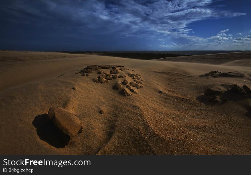 Sand dunes under full moon light