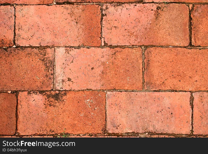 Close up view with texture of terra cotta brick floor