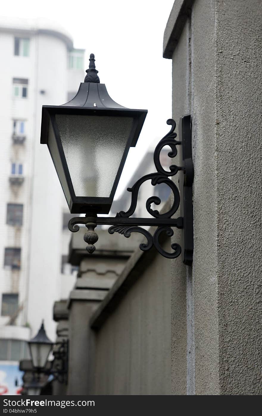 Lamp On Fence Wall