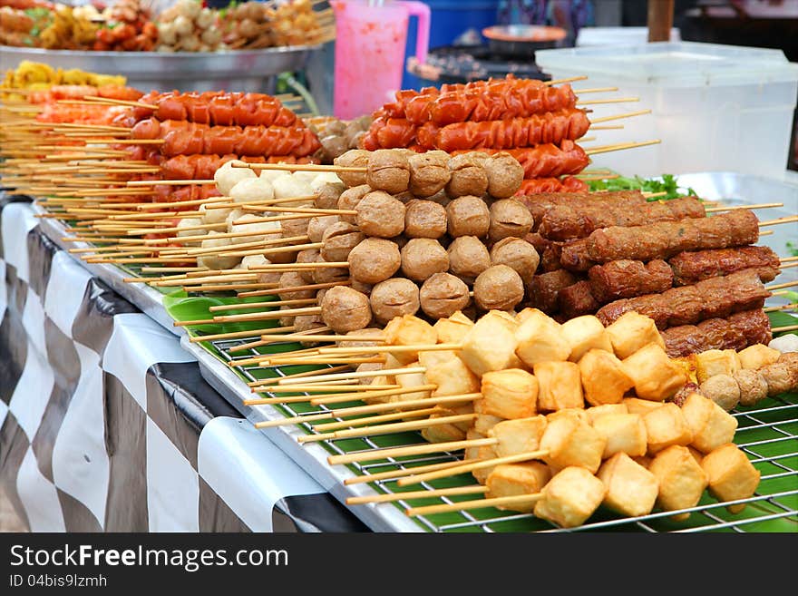 Meatballs on sticks at market