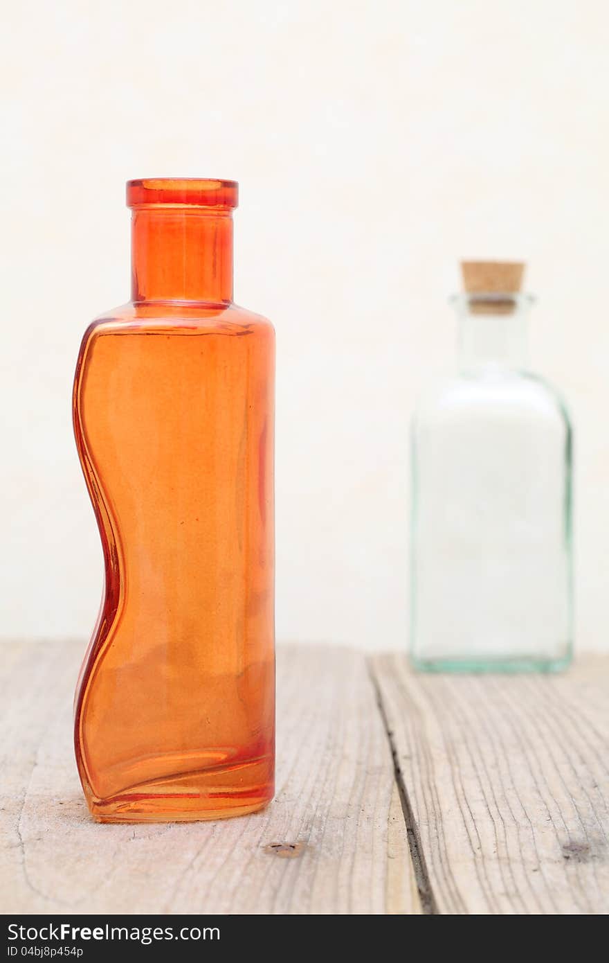 Old glass bottle on wooden table