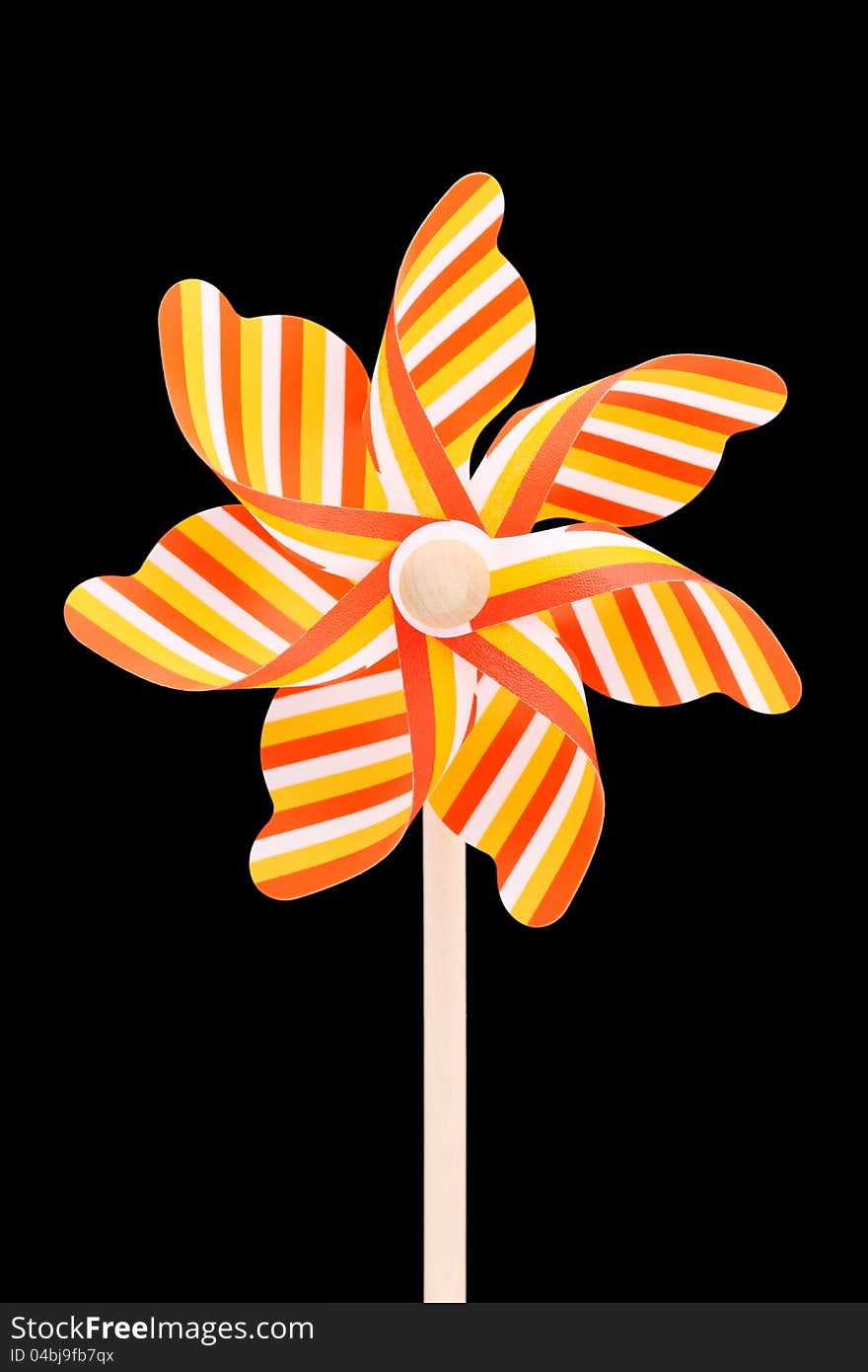 Colorful toy pinwheel on black background