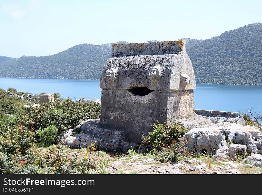 Taken on a walk along the Lycian way to Simena in Turkey. Shows a tomb surroundered by wild flowers. Taken on a walk along the Lycian way to Simena in Turkey. Shows a tomb surroundered by wild flowers