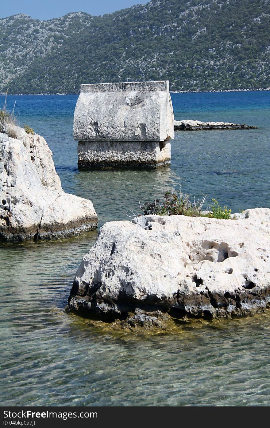 Taken on a walk along the Lycian way to Simena in Turkey. Shows a tomb surroundered by the sea. Taken on a walk along the Lycian way to Simena in Turkey. Shows a tomb surroundered by the sea