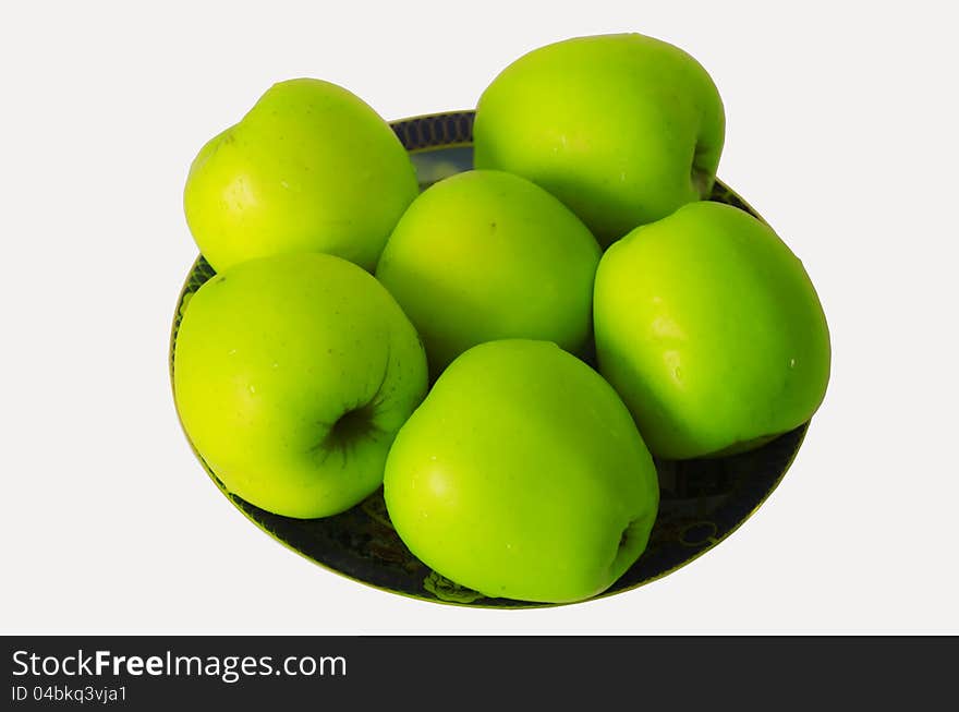 Green apples on a plate