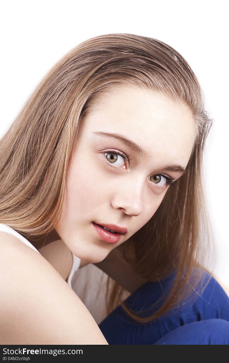 Portrait of young beautiful caucasian woman with blonde hair, studio shoot, over white background