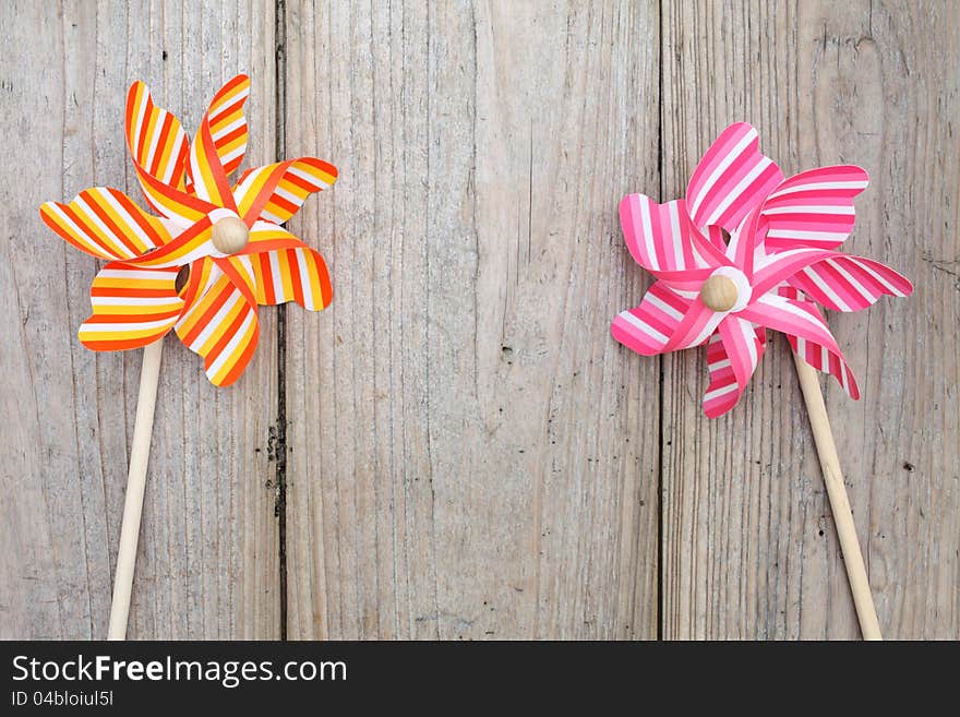 Colorful toy pinwheel on wooden table