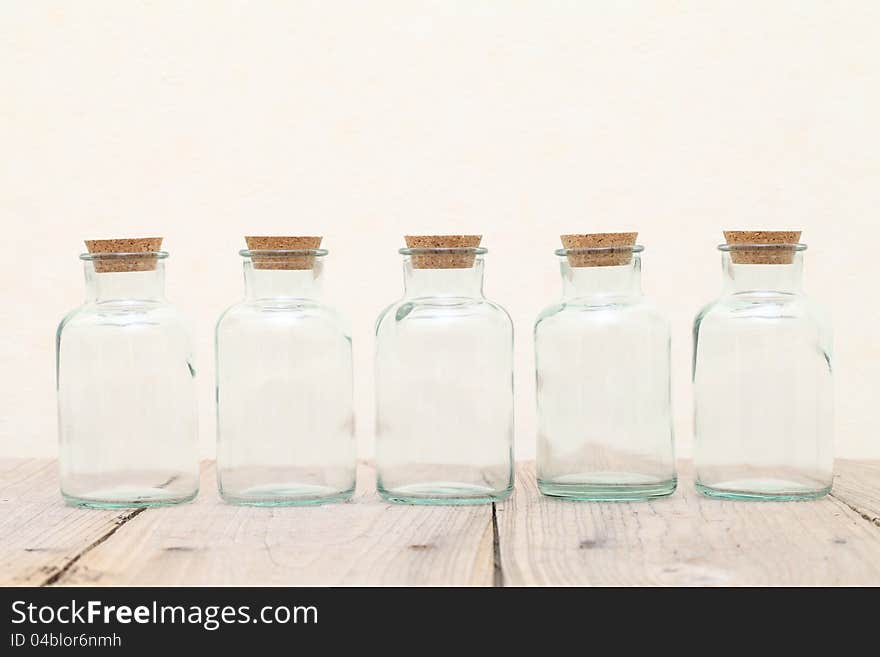 Old glass bottle on wooden table