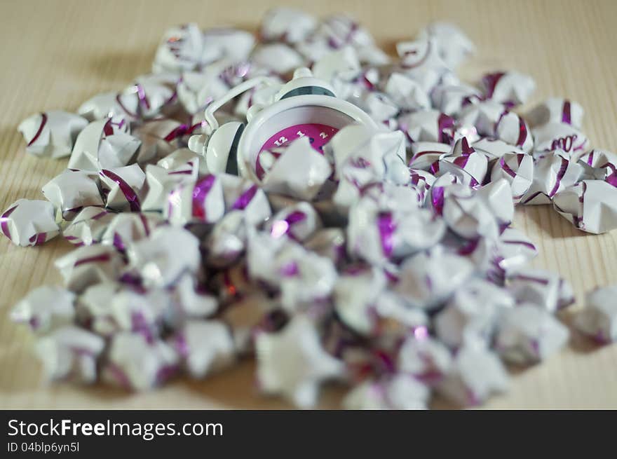 Clock mixed in the paper stars like a Lost time. Conceptual photography.