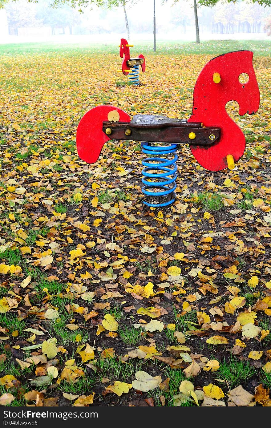 Young horses spring into a playground. Young horses spring into a playground