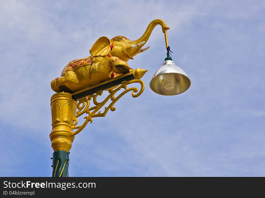 Elephant lamp on sky background