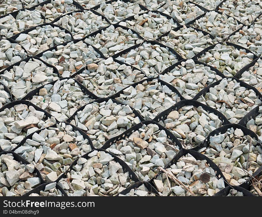 Bank protection made of gravel placed in the rubber cells. Bank protection made of gravel placed in the rubber cells